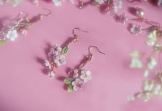 Embrace the delicate beauty of spring with our Sakura Crochet Earrings, an exquisite representation of the cherished cherry blossom. These handmade crochet ear studs are a testament to dainty pink floral jewelry, featuring the fine detail of micro crochet work. As light as a petal on the breeze, these lightweight earrings are perfect for everyday wear, yet elegant enough for bridesmaids and special occasions.  Influenced by Korean earrings style and the kawaii aesthetic, these sakura earrings bl Crochet Cherry, Cherry Blooms, Micro Crochet, Sakura Flowers, Flowers Earrings, Floral Studs, Personalised Gift Boxes, Floral Jewelry, Chic Pink