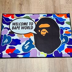 a door mat with a cartoon gorilla on it that says welcome to bape world