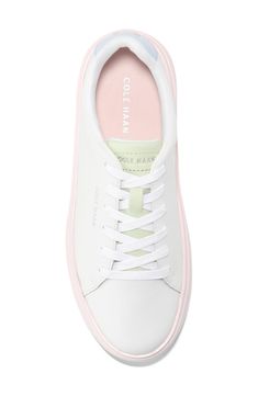 This sleek leather sneaker with clean lines inspired by classic tennis styles has rubber caps at the toe and heel for added traction. Round toe Lace-up style Removable cushioned footbed Leather upper/textile lining/synthetic and rubber sole Imported Modern Sneakers With Contrast Sole For Spring, Classic Sneakers With Gum Sole For Spring, White Low-top Platform Sneakers With Rubber Heel Cap, White Platform Sneakers With Gum Sole For Spring, Pink Low-top Sneakers With Rubber Toe Cap, Spring Sneakers With Rubber Toe Cap, Sporty White Platform Sneakers With Rubber Heel Cap, Classic Synthetic Sneakers For Spring, White Lace-up Platform Sneakers With Rubber Heel Cap