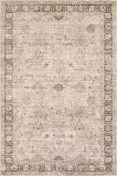 an antique style rug with beige and black accents