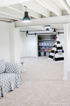 an empty room with black and white decor