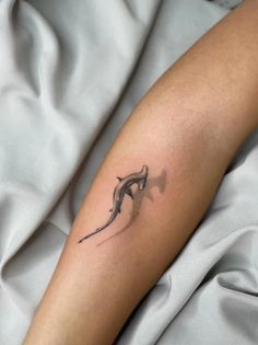 a person with a tattoo on their arm