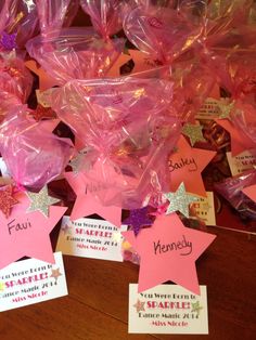 there are many pink stars with name tags on them