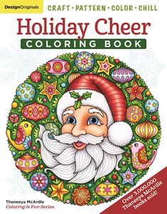 an adult coloring book with a santa clause on the front and christmas decorations in the background