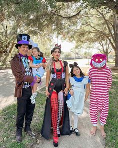 three adults and two children dressed up in costumes