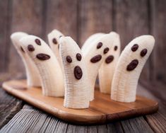 four bananas with chocolate chips on them and the words healthier halloween snacks