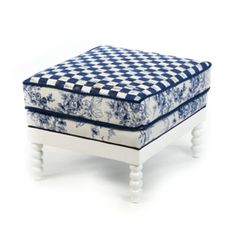 a blue and white checkered foot stool