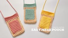 three crocheted purses sitting next to each other