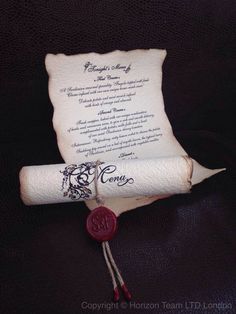 a scroll with a wax stamp on it