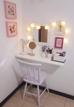 a white desk topped with a mirror and lights