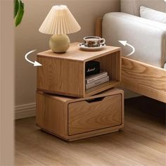 a night stand with two drawers and a lamp on the end table next to it