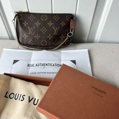 Authentic Lv Mini Pochette . Rare Find Already. Lv No Longer Selling This . Complete With Box , Dustbag And Certificate Of Authenticity Hardware Still Gold Exterior Pristine Condition Interior Very Clean And No Strange Smell Pls Not I Already Changed The Chain. Can Be Used As A Clutch/ Pouch Or Use The Chain . Lv Mini Pochette, Louis Vuitton Pochette, Clutch Pouch, Vuitton Handbags, Louis Vuitton Bag, Dust Bag, Bag Lady, Louis Vuitton, Pouch