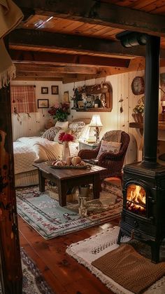 a living room filled with furniture and a fire place in the middle of it's floor