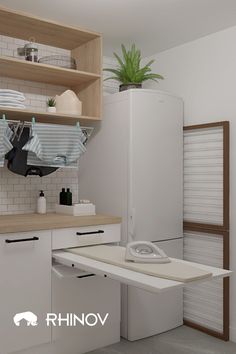 a white refrigerator freezer sitting inside of a kitchen