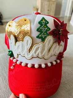 a red hat with christmas decorations on it