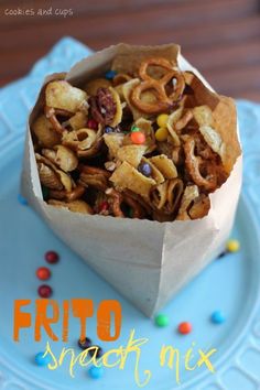 a paper bag filled with cereal on top of a blue plate