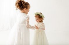 This beautiful ivory lace dress is perfect for your little one! The vintage style lace bodice along with the beautiful tulle skirt is just gorgeous. This long sleeved style is perfect for any special occasion!🌟 Check out The Tyra Dress-White! Size Length Bust 0-3 months 18" 16" 6 months 21" 18" 12 months 24" 20" 2T 25" 21" 3T 28" 22" 4 30" 23" 5 32" 24" 6/7 34" 25" 8/9 37" 27" 10/12 40" 28.5" 14 45" 30" 16 52" 33" Winter Flower Girl Dress, Ivory Lace Dress, 25 21, Lace Bodice, Flower Girl Dress, Ivory Lace, Ivory Color, Girl Dresses, Online Boutiques