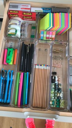 an organized drawer with pens, pencils, markers and other crafting supplies in it