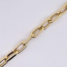 This fantastic 6 millimeter (mm) wide paperclip medium link chain was made for us in Italy with recycled 14 karat gold and finished beautifully to the high standards Italian jewelry is known for! This wonderful statement chain is made affordable by the lightweight design of the links. Metal Quality: 14 karat yellow goldComplete Weight: 4.0 gramsBracelet Type: Chain BraceletChain Type: Lightweight Paperclip LinkMeasurements: 7.5 inches long, 6 mm wide (each link 12.3 mm long)Clasp: Oval ellipse l Luxury Gold-tone Oval Link Paperclip Bracelet, Luxury Yellow Gold Bracelet With Clasp, Classic Gold Chunky Link Bracelet, Modern Chain Necklace With Rectangular Links And Polished Finish, Luxury Paperclip Bracelet With Oval Links, Luxury Yellow Gold Paperclip Bracelet With Gold Chain, Formal Gold Bracelet With Chunky Oval Link Chain, Yellow Gold Bracelet With Chunky Oval Link Chain, Luxury Gold Chain Link Paperclip Bracelet