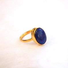 Lapis Lazuli Yellow Gold Ring-9K,14K,18K,22K Solid Gold Rings-January Birthstone Gold Ring -Gold Wedding Ring -Yellow Gold Ring- Lapis Ring Available in 9K,14k,18K,22K yellow solid gold bezel and solid yellow gold ring are both shined to an extremely high polish. But if you prefer it in matte convo me after purchasing. The main stone is natural Lapis Lazuli Gemstone. The pictures have been enlarged to show the details. The band is about 2 mm wide and 1 mm thick. This ring is made to order in you Classic Gold Stackable Rings With Gemstones, Classic Gold Opal Gemstone Ring, Gold Crystal Ring With Gemstone In 14k Gold, Gold Round Opal Ring As Gift, Gold Opal Ring For Gift, 14k Gold Crystal Ring With Gemstone, Gold Opal Gemstone Ring Gift, Gold Opal Gemstone Promise Ring, Gold Rings With Gemstone For Fine Jewelry