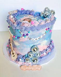 there is a cake that looks like it has many decorations on it, including beads and keys