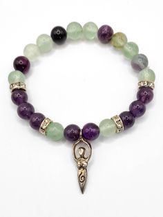 Start each day with a clear mind and positive energy with the Earth Goddess Bracelet. Crafted using genuine rainbow fluorite and amethyst crystal beads adorned with a silver goddess charm, this bracelet will guide you through daily challenges with confidence and calm. Rainbow Fluorite & Amethyst Properties: Fluorite acts like a vacuum cleaner for your mind, clearing it of confusion, cluttered thoughts, negativity, and any thoughts that no longer serve you. Fluorite is known as the "Genius Stone" Silver Goddess, Amethyst Properties, Goddess Bracelet, Heart Chakra Healing, Earth Goddess, Healing Heart, Emotional Body, Daily Challenges, Clear Mind