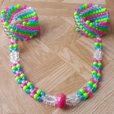 there is a necklace made out of beads on the floor