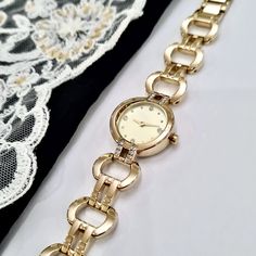 Wrist Watch for Woman, Gold Colour, Zirconia Stones on Dial and Case, Dainty Watch, Easy Usage, Stylish Design, Charismatic Design, Rectangle Design, Pearl Design Dial, Cool Design, Christmas Gift, Mother's Day Gift, Valentine's Day Gift Total Length: 22 cm Case Diameter: 25 mm Case Thickness: 8 mm Weigth: 55 gr Dainty Watch, Rectangle Design, Bracelet Watches Women, Watches Women, Pearl Design, Design Christmas, Gold Colour, Women Wrist Watch, Wrist Watches