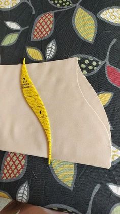 a piece of fabric with a measuring tape on it