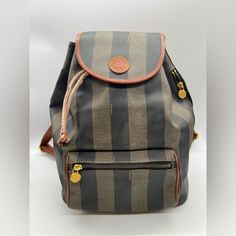 Vintage Fendi Pequin Drawstring Backpack With Adjustable Straps Brown Striped Coated Canvas Exterior, Light Brown Leather Piping And Straps Black Cloth Interior Gold Hardware Inside And Out Functional Zippers This Item Is Pre-Owned So There Are Signs Of Wear Such As Peeling,Scuffing,Scratches,Marks,Etc. Please Refer To The Photos For Those Details. $620 In Store Zarjp85508 Fendi Backpack, Vintage Fendi, Light Brown Leather, Gold Interior, Fendi Bags, Drawstring Backpack, Gold Hardware, Piping, Light Brown