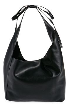 This medium-sized, slouchy leather tote with an asymmetric topline takes a subtle approach to the season's bow trend with a decorative tie detail on the strap. Magnetic closure Shoulder strap Interior zip pocket; card slot Fits most 13" laptops Leather lining Leather Imported Chic Hobo Bag With Smooth Grain For Shopping, Chic Smooth Grain Hobo Bag For Shopping, Chic Evening Hobo Bag With Smooth Grain, Leather Hobo Bag For Fall Evening, Chic Evening Bucket Bag With Smooth Grain, Chic Smooth Grain Bucket Bag For Evening, Chic Leather-lined Bucket Bag For Shopping, Chic Fall Shoulder Bag With Smooth Grain, Chic Smooth Grain Shoulder Bag For Fall