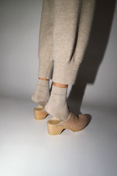 Slipper meet clog, clog meet slipper. Mid heel clog with sheepskin upper. Perfect for when the weather starts to get cold. We love this for indoors and outdoors. Fawn suede is a light tan suede with off-white shearling. Please note: This style has a low instep, initial fit may be snug. Upper will stretch and give with wear. Every clog is handmade. Certain styles may take up to 10 business days to arrive. DETAILS Sheepskin and cow leather upper. Wood base with polyurethane sole. 2.5" heel with 1" Shearling Clogs, No 6, Clog Heels, Light Tan, Tan Suede, Mid Heel, Cool Patterns, Cow Leather, Style Me