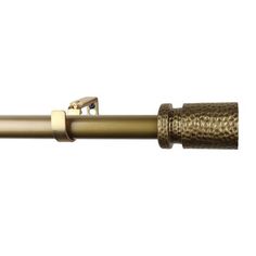 a gold colored metal pipe on a white background