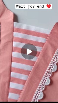 the video is showing how to sew on top of pink and white striped shirts