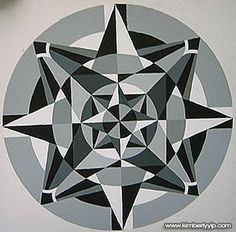 a black and white circular design on a wall