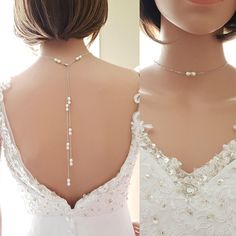 the back of a woman's wedding dress with pearls on it