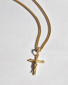 Choose the pendant that best expresses your faith. The yellow gold Crucifix Pendant is one of the newest additions to our men’s pendant collection and a best-seller. We’ve crafted this gold crucifix pendant with the best gold jewelry materials to create a standout shine and be comfortable as it remains close to your heart. Pair this 14k yellow gold-finished men’s crucifix pendant with a JAXXON gold chain to build your own gold crucifix necklace—an accessory you’ll never want to take off. Showcase your faith and add this gold crucifix necklace to your gold jewelry collection today. Gold Crucifix Necklace, Gold Jewelry Collection, Gold Cuban Link Chain, Jewelry Materials, Crucifix Necklace, Solid Gold Chains, Silver Shop, Mens Gold, Men's Rings