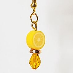 a lemon slice is hanging from a chain