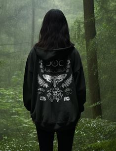 Immerse yourself in the cozy warmth of the Forest Witch zip-up hoodie. Designed to embrace the colder months, these hoodies are the perfect outer layer for modern mystics seeking both comfort and style. Crafted from cotton/polyester blend, they provide a soft and warm embrace that keeps you snug while radiating an aura of mystic charm. Elevate your winter wardrobe and stay cozy in this zip-up hoodie that blend comfort, style, and the essence of modern mysticism. + Printed on Lane Seven Unisex Fu Moth Hoodie, Dark Hoodie, Mushrooms Forest, Goth Hoodie, Forest Witch, Hoodie Aesthetic, Hoodie Size Chart, Black Milk, Wrinkle Remover