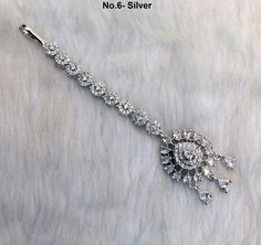 *silver, rose gold CZ stone headpiece tikka. Light in weight. Elegant Silver Tikka For Festivals, Elegant Silver Tikka For Festive Occasions, Silver Tikka With Tilla For Celebration, Elegant Silver Tikka With Stone Work, Elegant Silver Hand Set Tikka, Elegant Silver Hand-set Tikka, Silver Wedding Tikka, Silver Cubic Zirconia Tikka For Wedding, Silver Cubic Zirconia Wedding Tikka