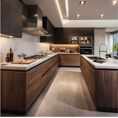 a modern kitchen with wooden cabinets and white counter tops, along with an island in the middle