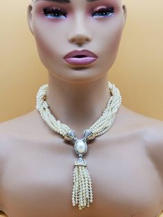 In beautiful vintage condition.  Clearly stamped Vb. Gold tone metal with sparkly clear stones and 10 strands of faux Pearls. Very classy looking, very well made. The strands can be twisted when the necklace is open to make it a little shorter/ longer. Please look at the pictures for details and condition or message me with any questions Evening Multi-strand Pearl Necklace, Glamorous Beaded Pearl Necklace, Evening Beaded Pearl Necklace In Costume Jewelry Style, Multi-strand Pearl Necklace For Party, Multi-strand Pearl Necklace For Formal Occasions, Beaded Pearl Necklace For Evening In Costume Jewelry Style, Costume Multi-strand Pearl Necklace For Party, Evening Beaded Costume Pearl Necklace, Formal Costume Multi-strand Pearl Necklace