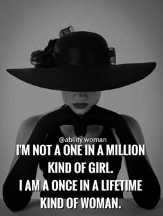 a woman wearing a black hat with the words i'm not a one in a million