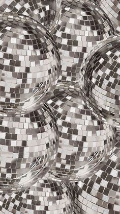 an image of some disco balls that are in the middle of it's reflection