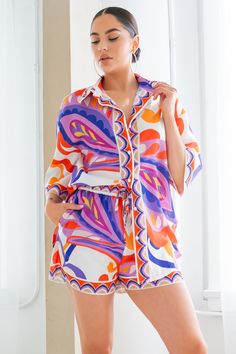 Joanna Short Set is perfect for summertime style. This fun and chic set features options for you to express your individual style - tuck, tie, or slide the top off the shoulders for an ultra-chic look. You'll be sure to turn heads this season.Top— oversized fit. Style how you like.Shorts— elastic waist w/pockets. Super-stretchy lining. Semi-sheer linen fabric Oversize button-down shirt with short pants set Pants are in-lined Detail 100% POLYESTER Size & Fit The model is 5'7" and wearing a size S Chic Multicolor Blouse For Day Out, Trendy Summer Blouse For Vacation, Trendy Summer Vacation Blouse, Trendy Blouse For Summer Vacation, Summer Day Out Set With Short Sleeves, Summer Day Out Sets With Short Sleeves, Summer Day Out Sets, Playful Summer Blouse For Vacation, Chic Summer Blouse For Loungewear