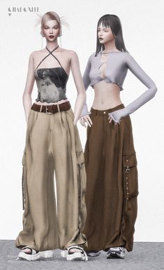 two women standing next to each other in front of a white wall and wearing pants