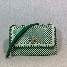 Small Kira Woven Leather Shoulder Bag/Cross Body Bag By Tory Burch. Style Number 148536 This Bag Is Made Of Green And Cream Hand Woven Genuine Leather. This Bag Is Convertible. Can Be Carried As A Shoulder Bag Or Cross Body Bag. Dimensions: 9" Wide Across Bottom X 6" Tall Center X 3.2" Deep. Strap Drop Doubled 12", Single 22". Interior: 1 Compartments. 2 Slip Pockets And 1 Zipper Pocket. Flap Closure Secured With Magnetic Button. Fabric Lining. Gold Tone Metalware. Designer Green Flap Bag For Travel, Green Top Handle Shoulder Bag With Magnetic Closure, Green Leather Bag With Magnetic Closure, Green Satchel Flap Bag With Magnetic Closure, Green Crossbody Bag With Magnetic Closure, Designer Green Flap Bag For Everyday Use, Luxury Green Tote Flap Bag, Green Rectangular Shoulder Bag With Magnetic Closure, Green Satchel Bag With Magnetic Closure