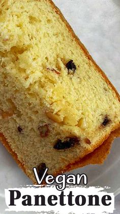 a piece of cake on a plate with the words vegan panettoe above it