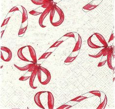 red and white candy canes with bows on them