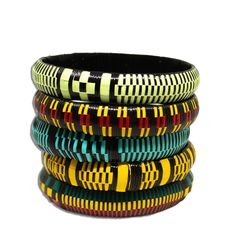 Transform your look effortlessly with these handmade African bangle bracelets they bring vibrant and captivating colors to any ensemble, making them the perfect addition to your collection. Elevate your style and infuse your day with a burst of color!  Styling Tip: Try a crisp white shirt, with sleeves rolled up and these colorful bangles and a bold lip.  Details: 5 in a set Assorted colors You get 1/2 inch wide bangles  Handmade African Bangle Bracelets: Crafted from vibrant, multi-colored prayer rugs in West Africa, each bracelet exudes unique, eye-catching colors. Handmade Artisan Bangle, Yellow Bangle Bracelet For Festivals, Handmade Green Bangle For Festival, Handmade Green Bangle For Festivals, Green Bangle Friendship Bracelets, African Bangles, Tuareg Jewelry, African Bracelets, Colorful Bangles